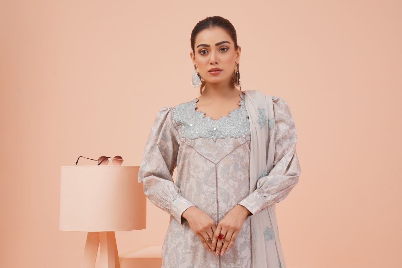 Portrait of a woman in elegant traditional clothing, showcasing fashion and style in Lahore, Pakistan.